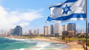 The Tel Aviv-Jaffa coast line with an Israeli flag in the foreground