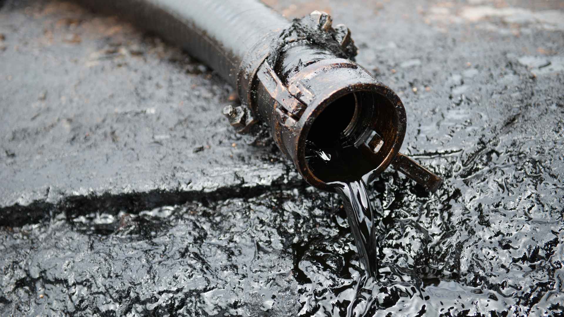 Oil spilling out of a pipe