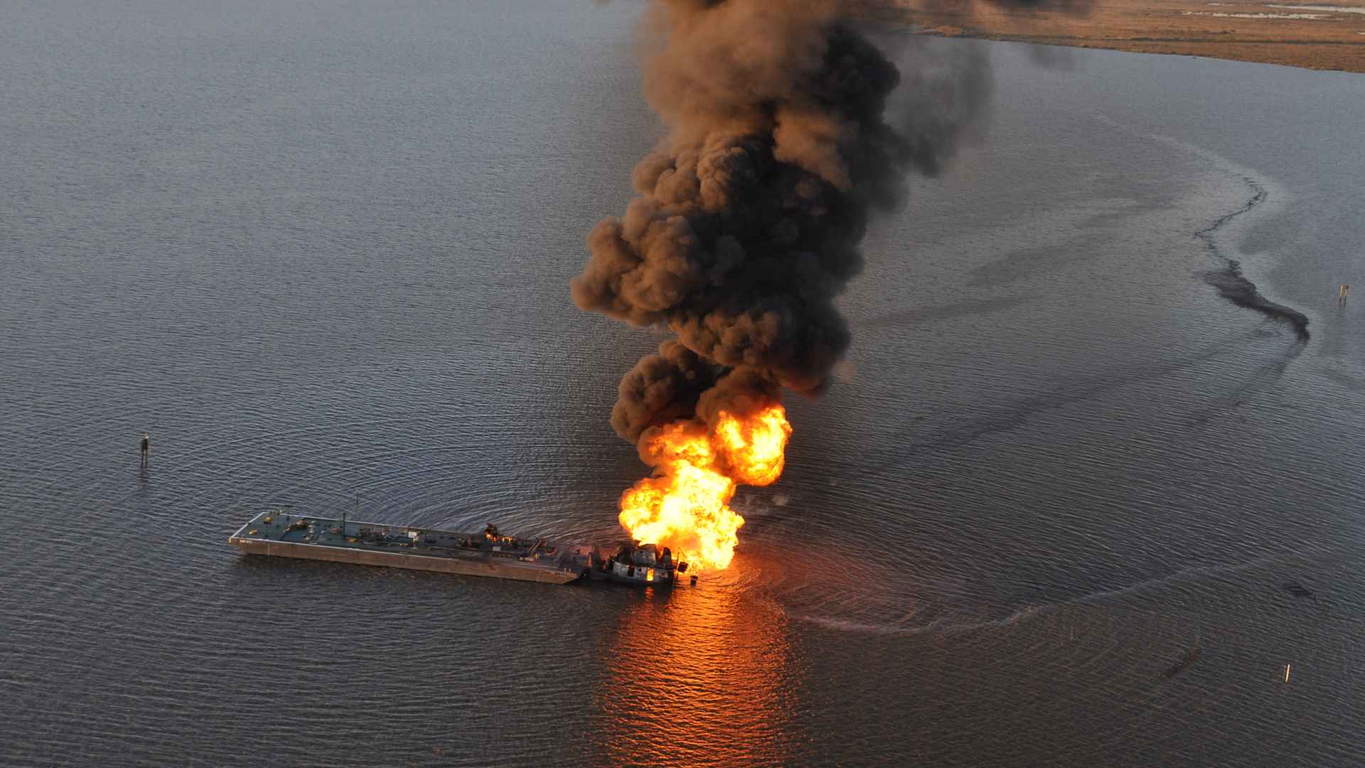 "Coast Guard continues response to allision, oil spill south of New Orleans [Image 1 of 3]" by DVIDSHUB is licensed under CC BY 2.0.